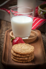 Stack of freshly baked oat biscuits in a bowl.