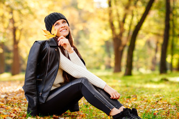 beautiful girl dreaming, relaxing in nature autumn, young woman in autumn Park