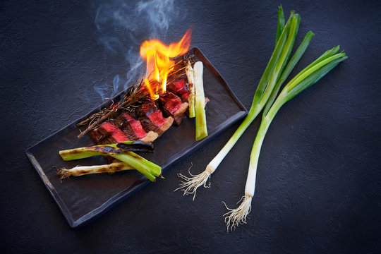 Beef carved meat with grilled fresh garlic