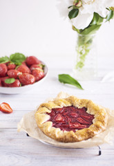 Baked galette or open pie with strawberry