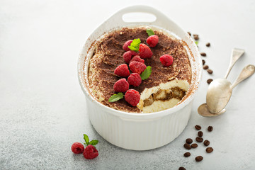 Tiramisu cake in a ceramic dish