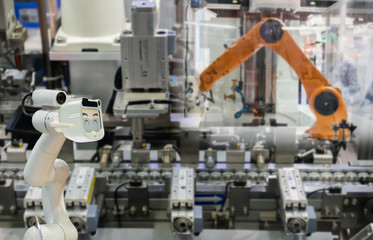 Robot replacement Industrial 4.0 of things technology robot future arm and man using controller for...