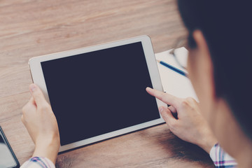 Asian businesswoman in the cafe and using tablet on table.