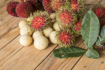 langsat,pulasan and rambutan on the wooden table