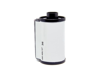 135 negative black and white film roll close up, isolated on white background.
