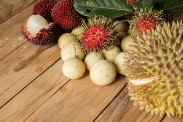 langsat,durian,pulasan and rambutan on the wooden table