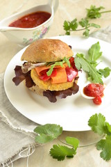 Vegetarian bean burgers with vegetables, served with sauce, vertical