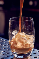 Cappuccino with ice with a transparent glass