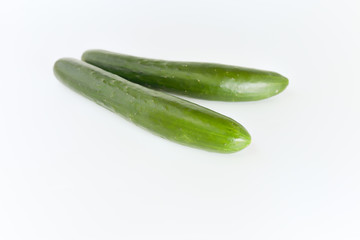 fresh green cucumbers isolated on white background.