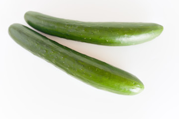 fresh green cucumbers isolated on white background.