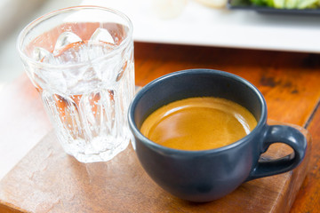 Shot of espresso served with soda water close up.