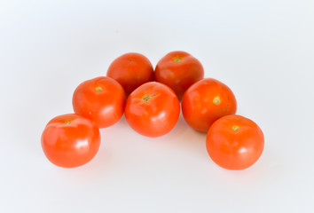 ripen tomatoes isolated on white background. selective focus.