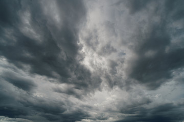 Naklejka na ściany i meble Dramatic thunder storm clouds at dark sky