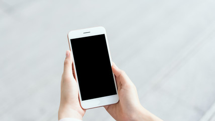 woman using smartphone on staircase in public areas, During leisure time. The concept of using the phone is essential in everyday life.