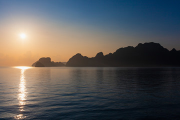 Naklejka na ściany i meble Tropical sunrise on the Ferry from Donsak pier to Koh Phangan.