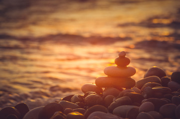 stack of zen stones on pebble beach