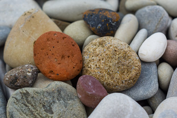 boulders and colorful pebbles on the beach