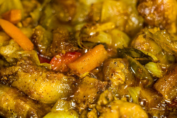 Roast meat, onions, carrots and spices, boiling in oil