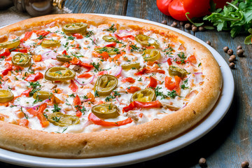 Spicy pizza with vegetables and jalapeno