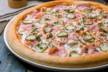 pizza with ham and cucumbers