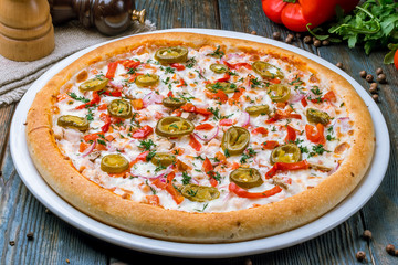 Spicy pizza with vegetables and jalapeno