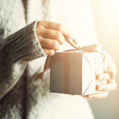 Female hands opening gift box, copy space. Christmas, hew year, birthday concept. Banner