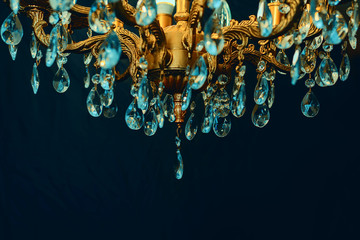 Crystal chandelier close-up. Dark background