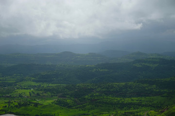 Obraz premium Lush green monsoon nature landscape mountains, hills, Purandar, Pune, Maharashtra, India 