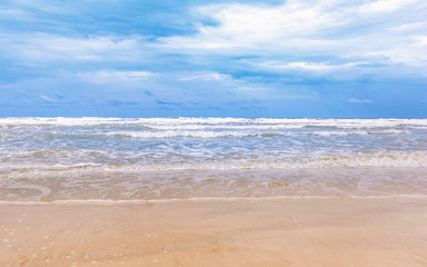 Fototapeta na wymiar beautiful cleaning beach with cloudy blue sky