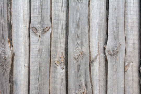 Fototapeta Closeup of weathered wall made from boards of silver wood with knots