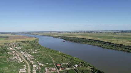 A stunning aerial view of summer landscape: huge river at sunny day