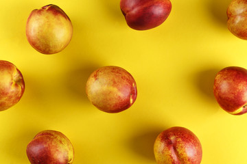 nectarines are scattered on the table