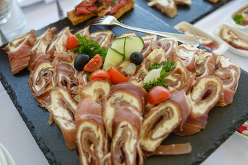 Meat rolls with green vegetables decorations