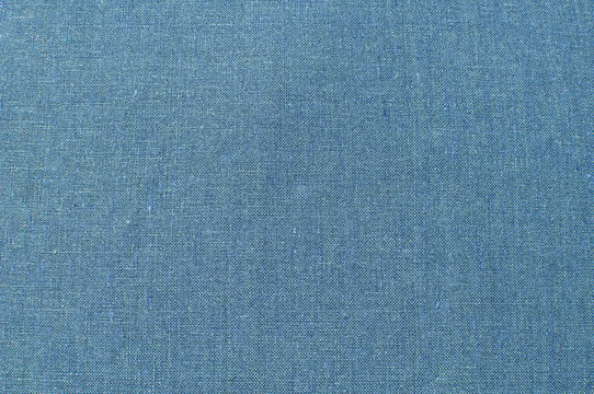 Blue linen fabric texture surface closeup as textile background