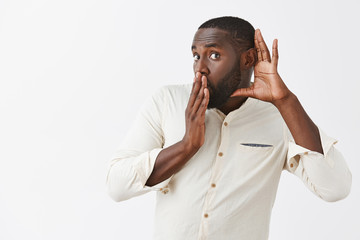 Whoa, incredible rumors, tell me more. Intrigued and amazed curious African American employee in...
