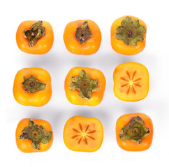 Top view of  fresh ripe persimmons isolated on white background