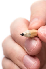 Close-up fingers holding a pencil, isolated on white background