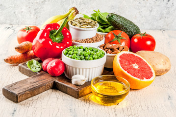 Healthy food background, trendy Alkaline diet products - fruits, vegetables, cereals, nuts. oils,...