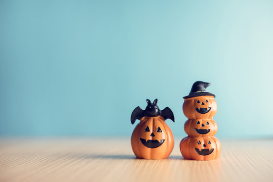 Happy Halloween, Two Pumpkin on table wood with blue wall background, Copy space.