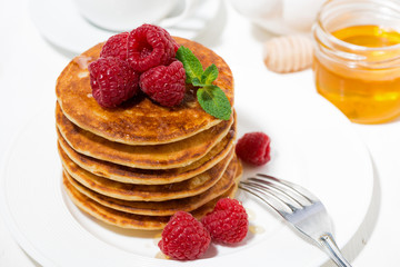 stack of pancakes with raspberries for breakfast, top view