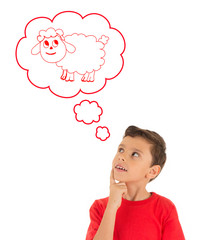 Young Boy looking up and dreaming with a sheep of Eid Ul Adha Feast
