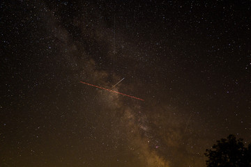 The Milky way with trail of ISS and an aeroplane
