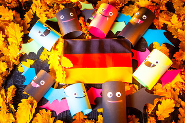 Holiday Halloween. Germany. Autumn holiday. Vampires against the background of yellow leaves. Decoration for the holiday of Halloween in Germany. flag of Germany.