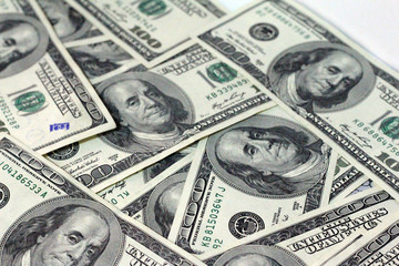 Cash of hundred dollar bills. A pile of one hundred US banknotes .100 Dollar.