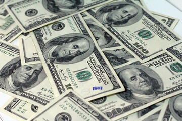 Cash of hundred dollar bills. A pile of one hundred US banknotes .100 Dollar.