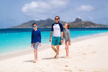 Father with kids at beach