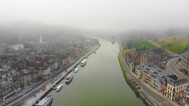 flight over city on river bank