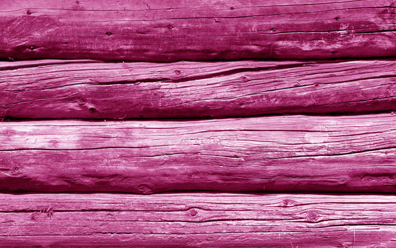 Old grunge wooden fence pattern in pink tone.