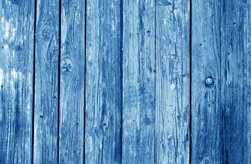 Old grunge wooden fence pattern in navy blue tone.