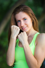 smiling young woman in fighting stance